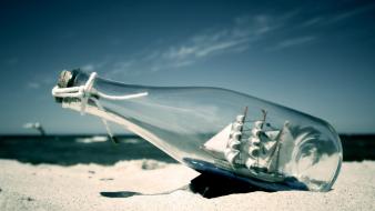 Bottles sand sea ship in bottle ships wallpaper
