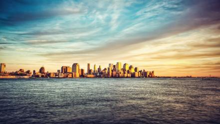 Water clouds city skyline sea wallpaper