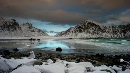 Coast cold stones snow mountains gloomy sky wallpaper