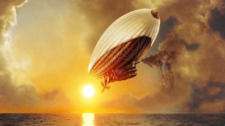 Sunset ocean clouds sun blimp wallpaper