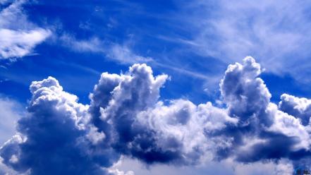 Blue clouds white fluffy skies wallpaper