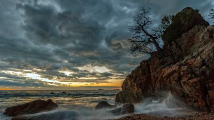 Sunset mountains ocean clouds landscapes trees stones skies wallpaper