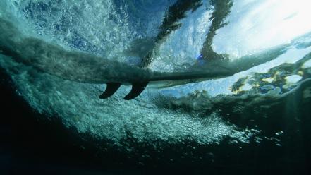 Surfing underwater barbados split-view wallpaper