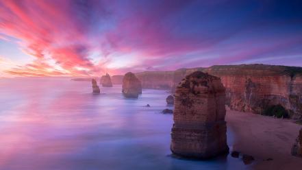 Sunset clouds coast beach horizon rocks skyscapes sea wallpaper