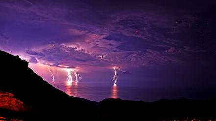 Pink violet eclipse lightning bolts skies sea wallpaper