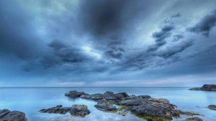 Clouds stones sea wallpaper