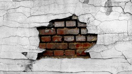 Wall holes bricks broken wallpaper