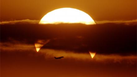 Sunrise clouds sun aircraft orange eclipse phillip skies wallpaper