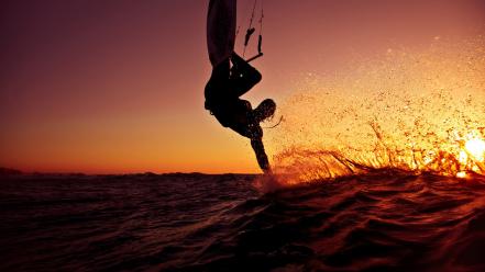 Sunset sports silhouettes surfing splashes sea wallpaper