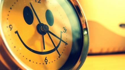 Close-up yellow design funny smiling alarm clocks creative wallpaper