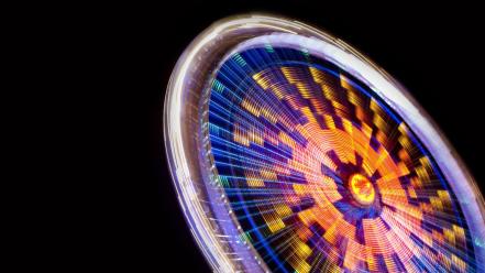 Black background ferris wheels lights long exposure multicolor wallpaper