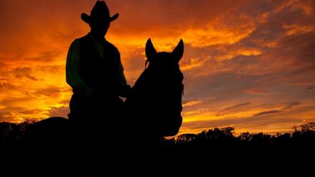 Cowboys horses men silhouettes sunset wallpaper