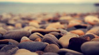 Beach pebbles depth of field wallpaper