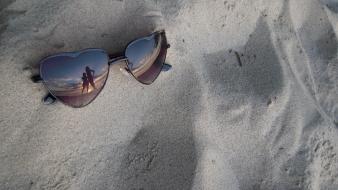 Beach sand silhouette sunglasses reflections