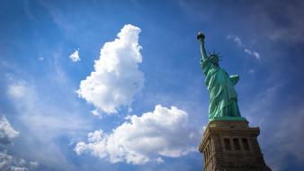 Statue of liberty islands skyscapes torch view wallpaper