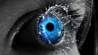 Close-up blue eyes liquid splashes eyeball wallpaper