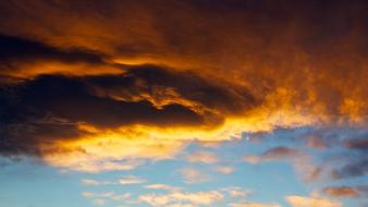 Light clouds orange gray darkness sky