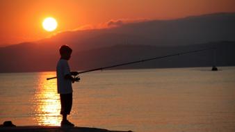 Boy sunset hills fishing