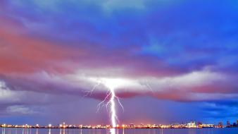 Landscapes lights storm lightning bolt cities skies sea wallpaper
