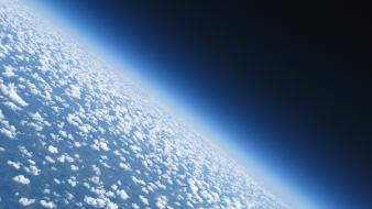 Clouds outer space earth wallpaper