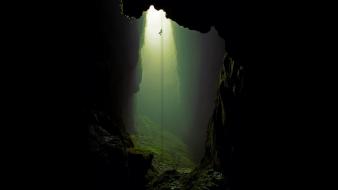 New zealand cave climbing silhouettes sunlight wallpaper