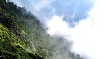 Clouds hills hillside landscapes mist wallpaper