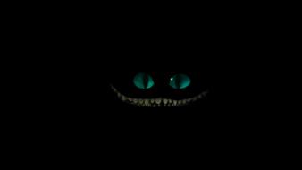 Wonderland smiling teeth cheshire cat glowing eyes wallpaper