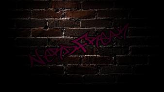 Nerdfreak brick wall graffiti shadows wallpaper