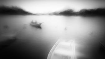 Black and white blur boats fog lakes