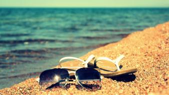 Glasses sand sea wallpaper