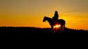 Wyoming horseback riding silhouettes sun flare sunset wallpaper