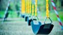 Swings chains playground blurred background wallpaper