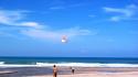 Sand kite couple blue skies sea beach wallpaper