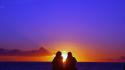 Romantic couple at sunset wallpaper