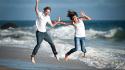 Beaches couple jumping smiling wallpaper