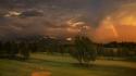 Trees grass rainbows golf course snowy peaks wallpaper