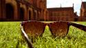 Blurred background buildings grass low-angle shot sunglasses wallpaper