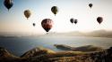 Hot air balloons mountains sea wallpaper